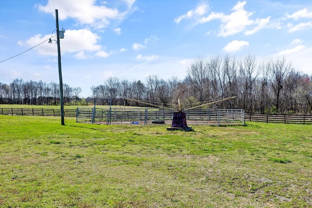 view of yard featuring fence and a rural view