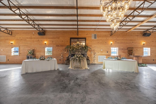 interior space with wooden walls and visible vents