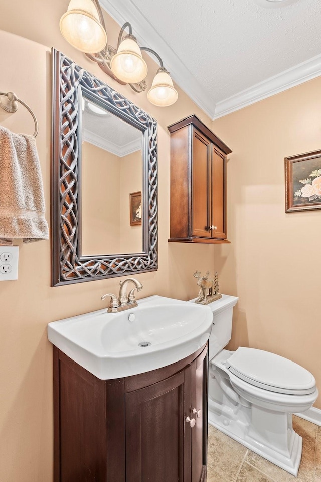 bathroom featuring ornamental molding, toilet, and vanity