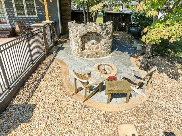 view of patio / terrace featuring a fenced backyard and a fire pit