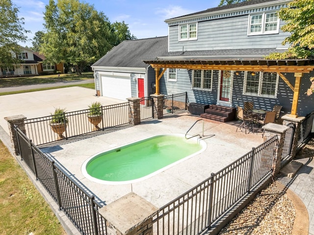 view of swimming pool with fence, entry steps, and a patio area