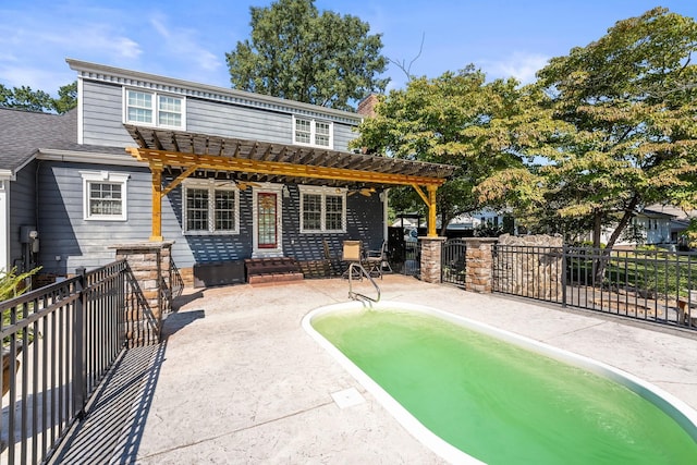 rear view of house with a patio, fence, and a pergola