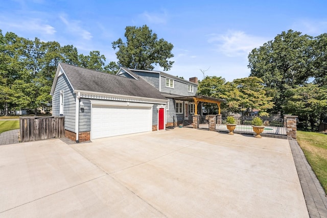 view of front of property featuring fence, an attached garage, driveway, a shingled roof, and a chimney