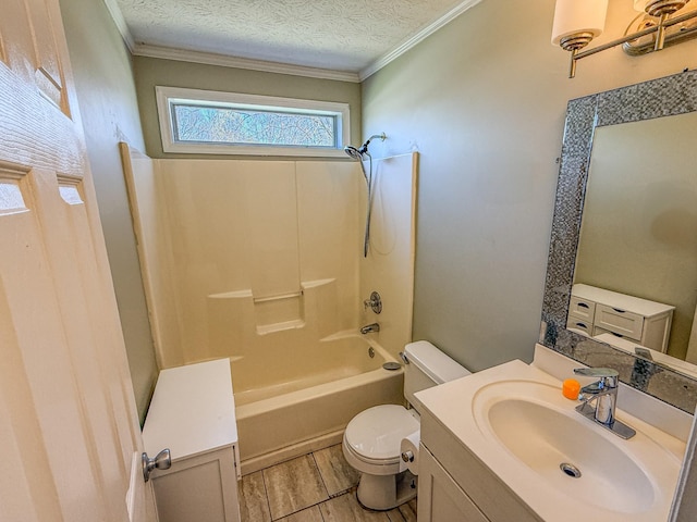 bathroom with vanity, toilet, wood finish floors, ornamental molding, and a textured ceiling