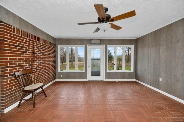 unfurnished sunroom with plenty of natural light and french doors