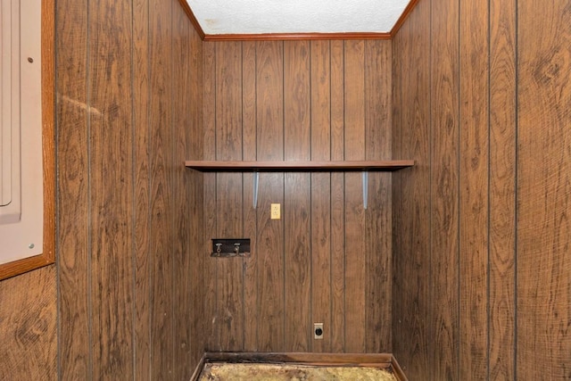 washroom with elevator, electric dryer hookup, and laundry area