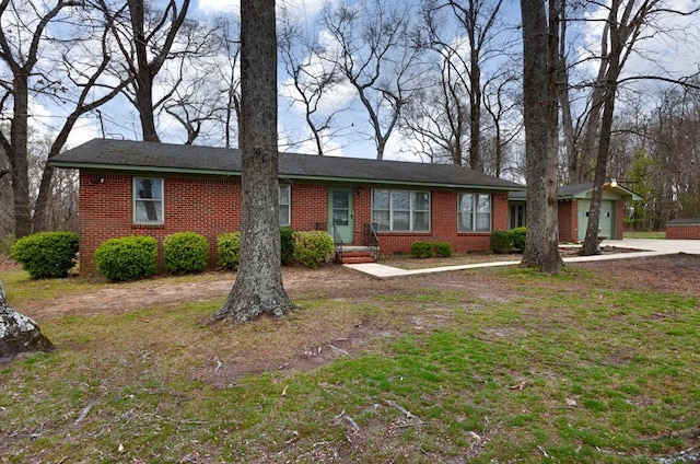 single story home with brick siding and an attached garage