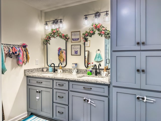 5113 Highland Lick Rd, Lewisburg, KY 42256 - bathroom with double vanity, baseboards, and a sink