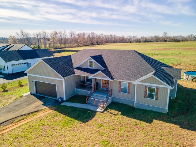 5113 Highland Lick Rd, Lewisburg, KY 42256 - view of front of house featuring driveway, an attached garage, a front lawn, and roof with shingles