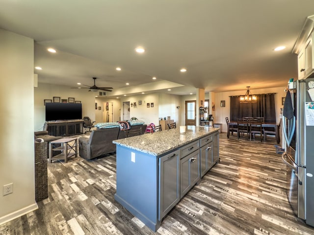 5113 Highland Lick Rd, Lewisburg, KY 42256 - kitchen featuring a kitchen island, dark wood-style flooring, ceiling fan with notable chandelier, and freestanding refrigerator