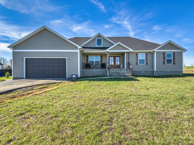 5113 Highland Lick Rd, Lewisburg, KY 42256 - view of front of house with driveway, a front yard, french doors, a garage, and a porch