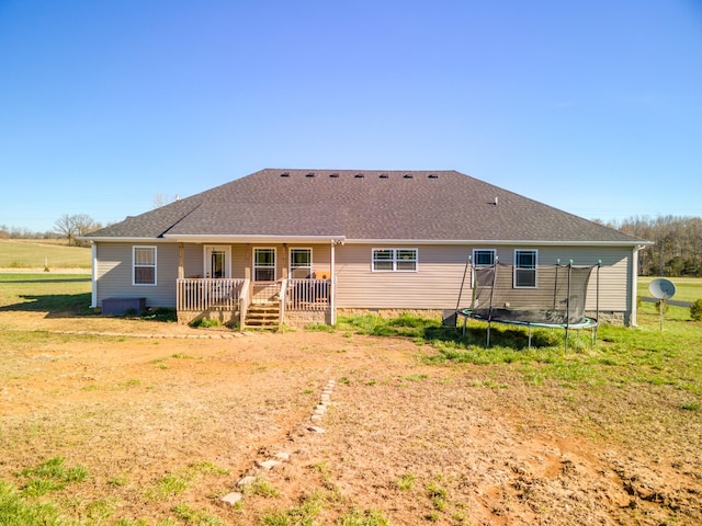 5113 Highland Lick Rd, Lewisburg, KY 42256 - rear view of property featuring roof with shingles, a wooden deck, and a trampoline
