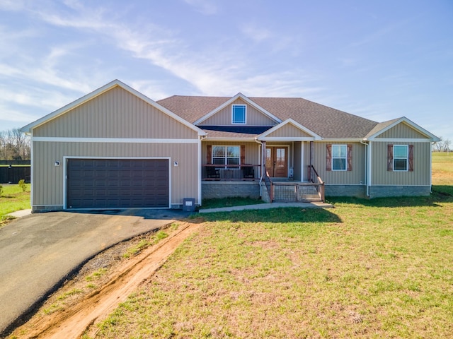 5113 Highland Lick Rd, Lewisburg, KY 42256 - view of front of house featuring a front lawn, driveway, a shingled roof, and an attached garage