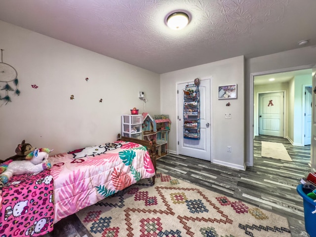5113 Highland Lick Rd, Lewisburg, KY 42256 - bedroom with a textured ceiling, baseboards, and wood finished floors