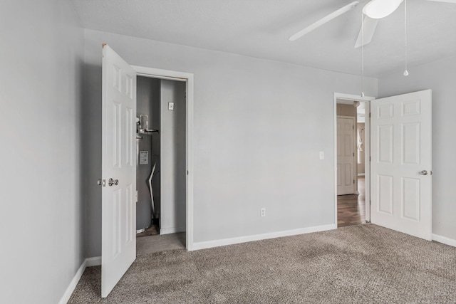 106 Hampton Dr, La Vergne, TN 37086 - unfurnished bedroom with a ceiling fan, water heater, carpet, and baseboards