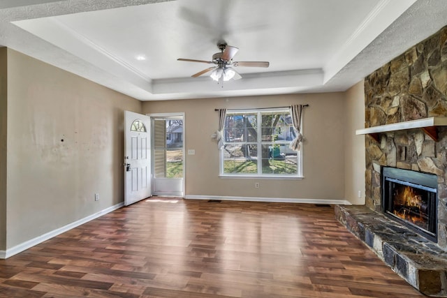 106 Hampton Dr, La Vergne, TN 37086 - unfurnished living room featuring a tray ceiling, wood finished floors, ceiling fan, and ornamental molding