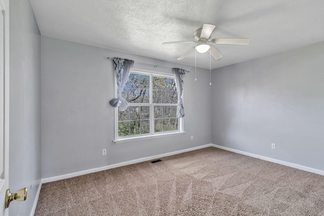 106 Hampton Dr, La Vergne, TN 37086 - carpeted spare room with baseboards, visible vents, a textured ceiling, and a ceiling fan