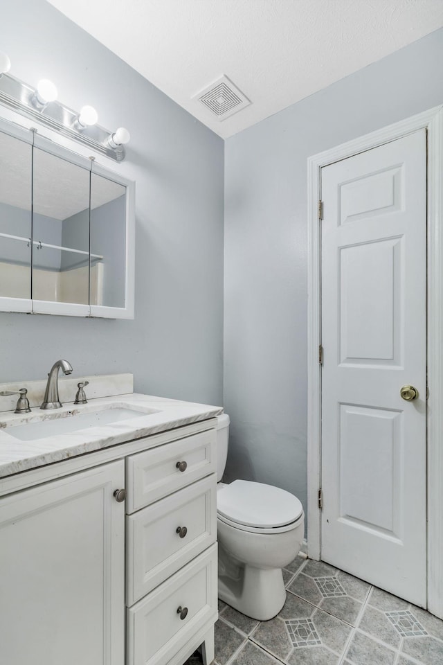 106 Hampton Dr, La Vergne, TN 37086 - bathroom featuring tile patterned floors, visible vents, toilet, and vanity