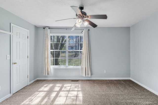 106 Hampton Dr, La Vergne, TN 37086 - carpeted empty room with baseboards, visible vents, ceiling fan, and a textured ceiling