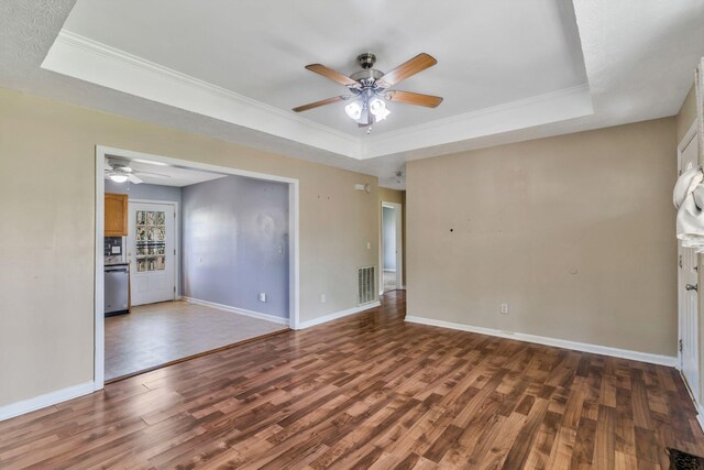 106 Hampton Dr, La Vergne, TN 37086 - unfurnished living room with a ceiling fan, a tray ceiling, and wood finished floors