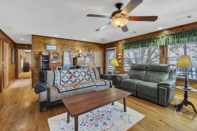 9395 Greenbriar Rd, Waverly, TN 37185 - living area featuring wooden walls, ceiling fan, light wood-style flooring, and recessed lighting