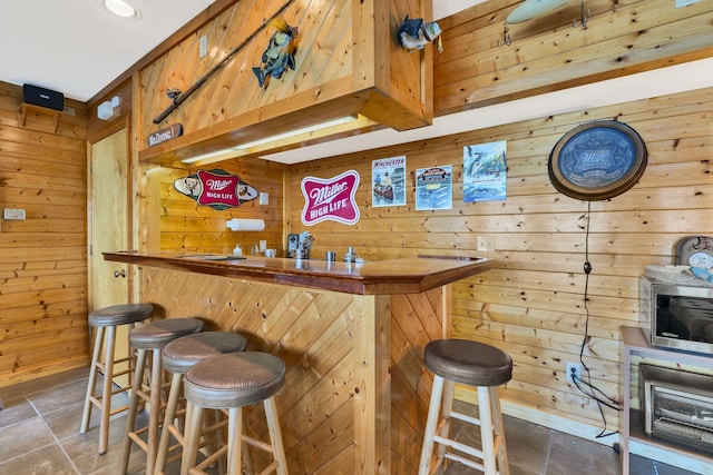 9395 Greenbriar Rd, Waverly, TN 37185 - indoor bar with wood walls and stainless steel microwave