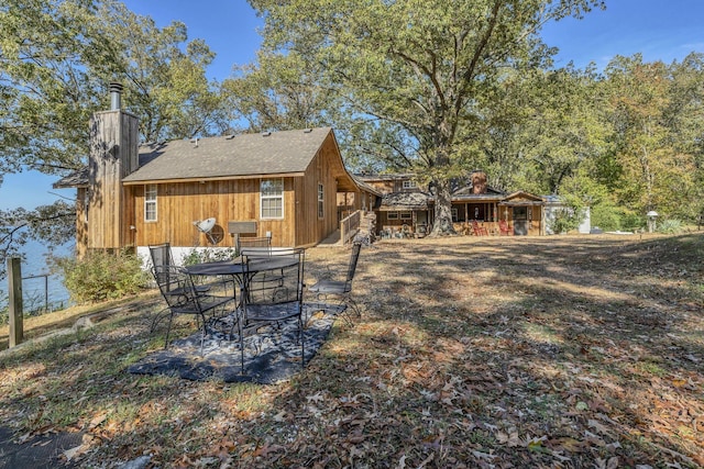9395 Greenbriar Rd, Waverly, TN 37185 - rear view of house with a chimney
