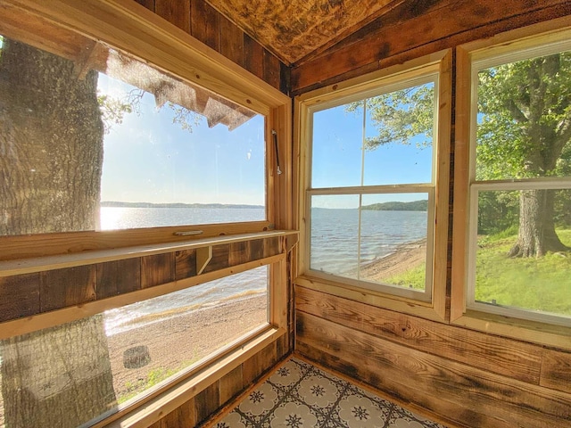 9395 Greenbriar Rd, Waverly, TN 37185 - unfurnished sunroom with a water view, wooden walls, and vaulted ceiling