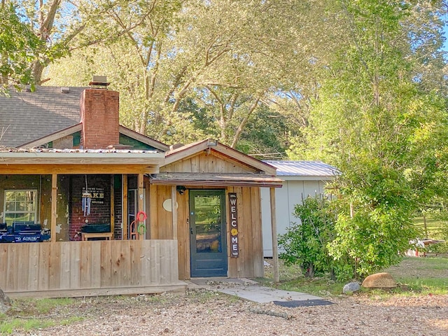 9395 Greenbriar Rd, Waverly, TN 37185 - view of front of property featuring a chimney and metal roof