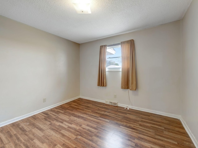 440 Appleton Dr, Clarksville, TN 37042 - empty room featuring baseboards, visible vents, wood finished floors, and a textured ceiling