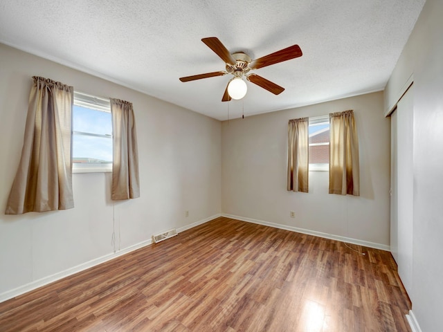 440 Appleton Dr, Clarksville, TN 37042 - spare room with visible vents, a wealth of natural light, wood finished floors, and ceiling fan