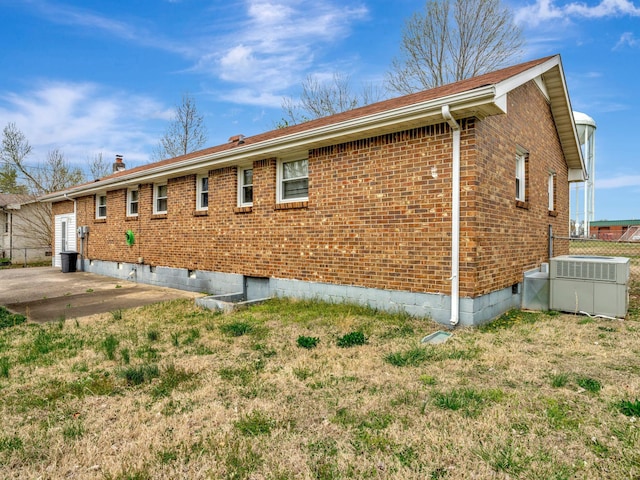 440 Appleton Dr, Clarksville, TN 37042 - view of side of home with crawl space, brick siding, cooling unit, a yard, and a patio area
