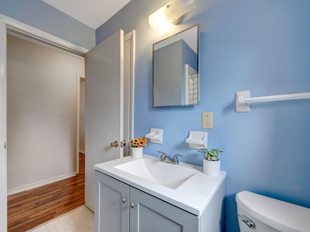 440 Appleton Dr, Clarksville, TN 37042 - bathroom featuring baseboards, wood finished floors, toilet, and vanity