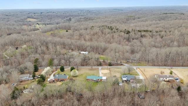 bird's eye view featuring a view of trees and a rural view