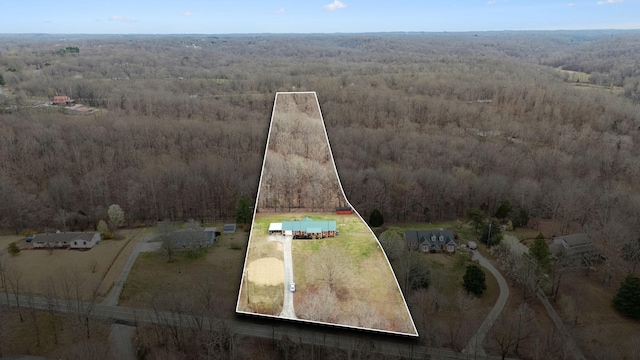 bird's eye view with a wooded view and a rural view