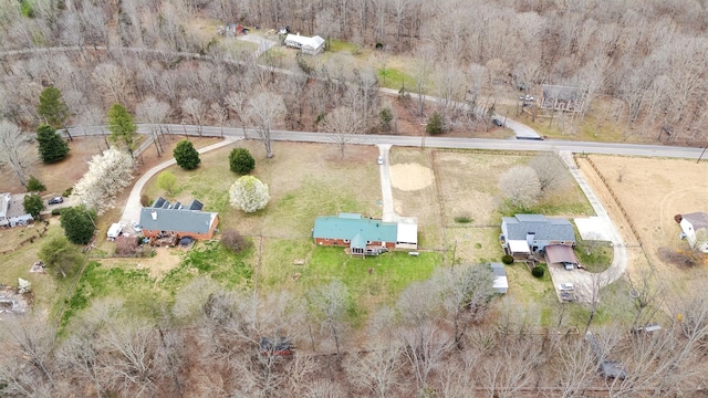 birds eye view of property with a rural view