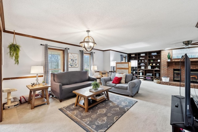 living area featuring a textured ceiling, a brick fireplace, ornamental molding, ceiling fan with notable chandelier, and carpet floors