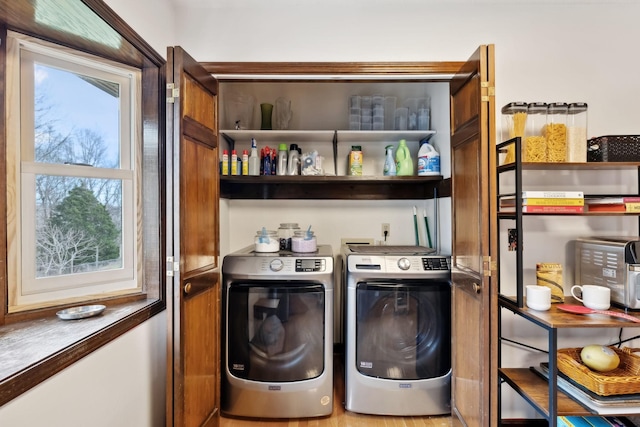 laundry area featuring washer and clothes dryer and laundry area