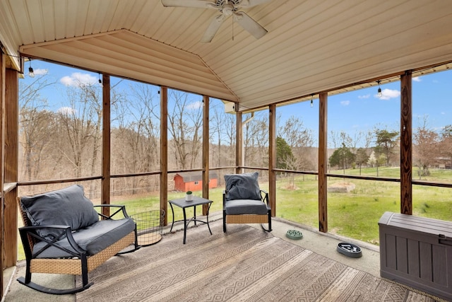 unfurnished sunroom featuring ceiling fan