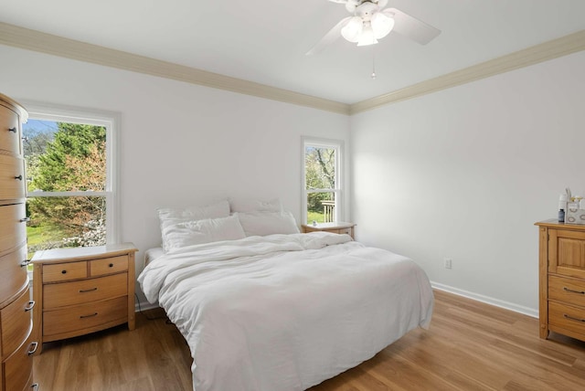6525 Chessington Dr, Nashville, TN 37221 - bedroom with baseboards, multiple windows, crown molding, and light wood finished floors
