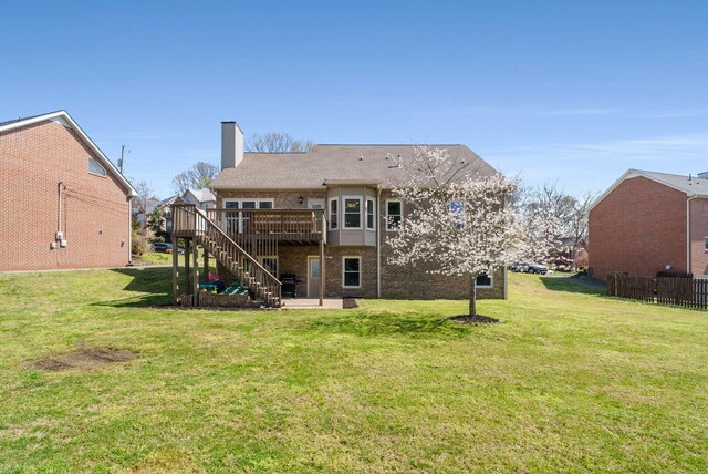 6525 Chessington Dr, Nashville, TN 37221 - back of property featuring stairway, a deck, brick siding, a yard, and a chimney
