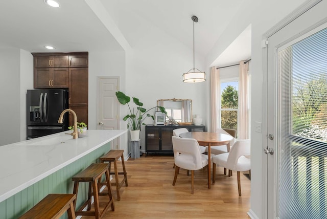 6525 Chessington Dr, Nashville, TN 37221 - dining room featuring light wood finished floors, lofted ceiling, and recessed lighting