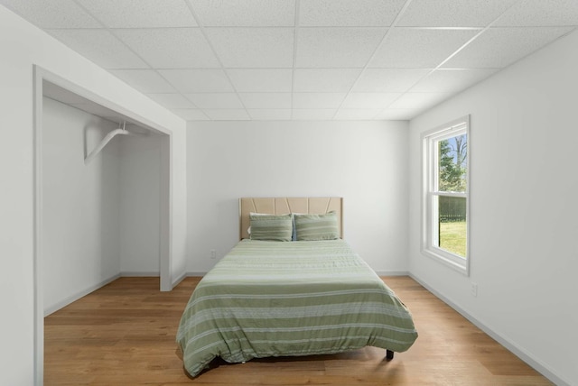 6525 Chessington Dr, Nashville, TN 37221 - bedroom with a drop ceiling, baseboards, and wood finished floors