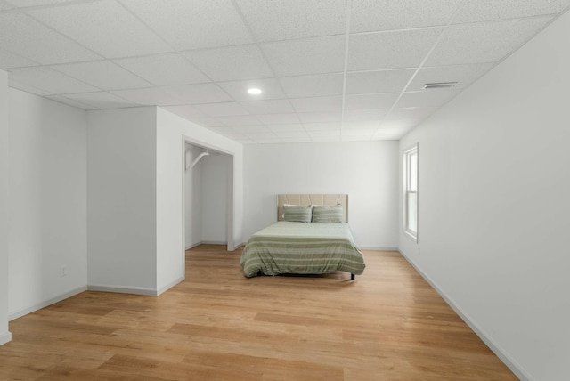 6525 Chessington Dr, Nashville, TN 37221 - bedroom with light wood finished floors, baseboards, visible vents, and a paneled ceiling
