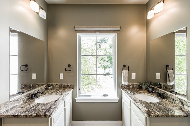 817 Burton Point Rd, Mount Juliet, TN 37122 - bathroom featuring baseboards, a sink, and two vanities