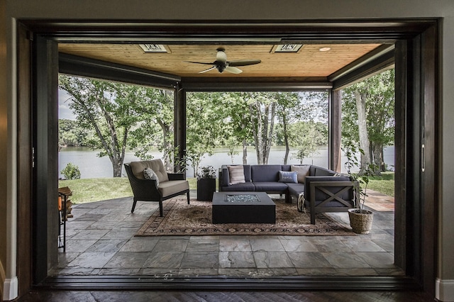 817 Burton Point Rd, Mount Juliet, TN 37122 - interior space with an outdoor living space with a fire pit, a water view, and ceiling fan