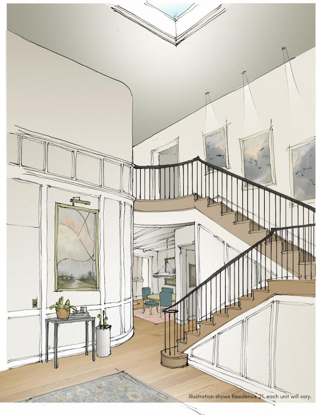 805 Columbia Ave Unit 12, Franklin, TN 37064 - stairway featuring a high ceiling, a skylight, and wood finished floors