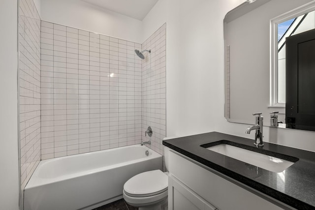 bathroom with toilet, vanity, and washtub / shower combination