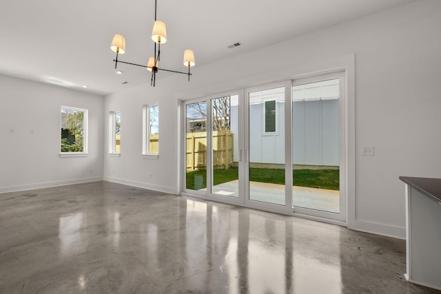 interior space with a notable chandelier, finished concrete flooring, baseboards, visible vents, and recessed lighting