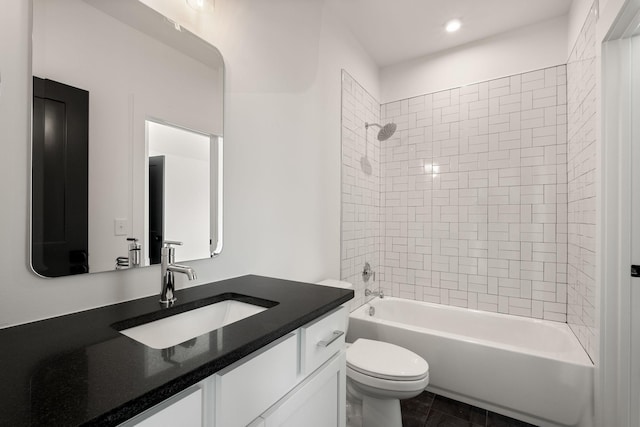 full bathroom featuring toilet, vanity, and bathing tub / shower combination